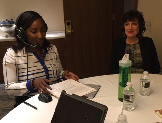 Anne Voller (right) records a podcast episode with host Shaquayla Mims (left).